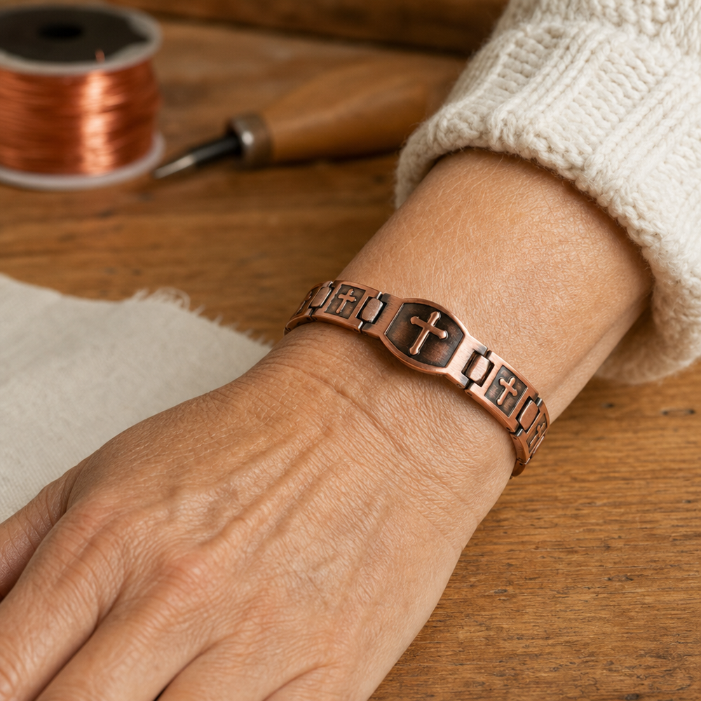 Rosalie copper cross bracelet on the wrist